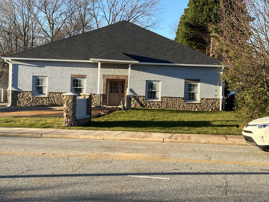 A finished brick building on a completed Good Wood job